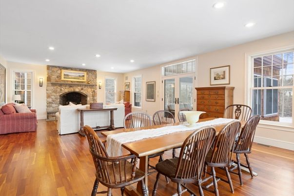 Dining room, Fireplace, Interior, Living room, Recessed Lighting, Stone Walls, Wood Texture Flooring