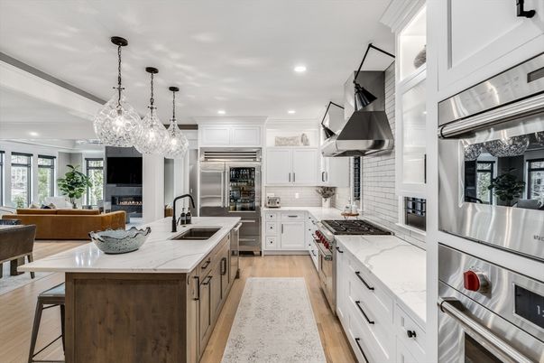 Fireplace, Interior, Kitchen, Living room, Pendant Lights, Recessed Lighting, Stainless Steel Appliances, Wood Texture Flooring