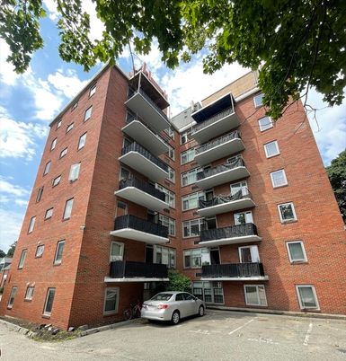 Exterior, Facade, Brick Facade, Condo Building