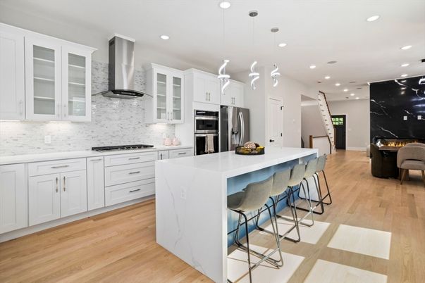Interior, Kitchen, Marble Walls, Pendant Lights, Recessed Lighting, Stainless Steel Appliances, Wood Texture Flooring