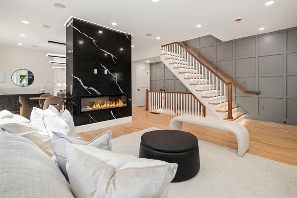 Fireplace, Interior, Living room, Marble Walls, Pendant Lights, Recessed Lighting, Wood Texture Flooring