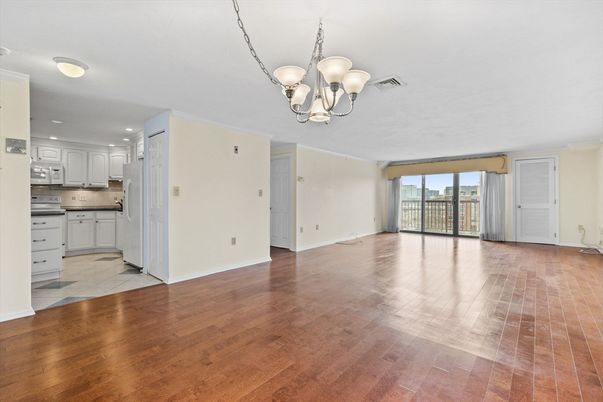 Chandelier, Empty room, Interior, Kitchen, Recessed Lighting, Stainless Steel Appliances, Wood Texture Flooring
