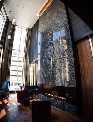 Fireplace, Interior, Living room, Marble Walls, Recessed Lighting, Wood Texture Flooring
