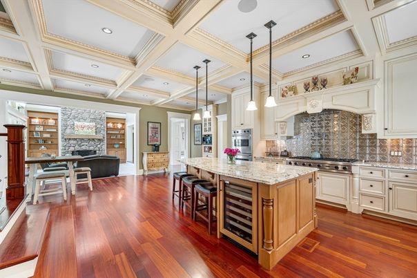 Fireplace, Interior, Kitchen, Pendant Lights, Recessed Lighting, Stainless Steel Appliances, Stone Walls, Wood Texture Flooring