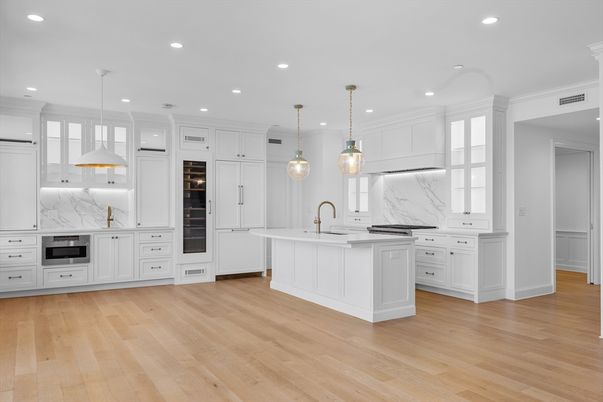 Interior, Kitchen, Marble Walls, Pendant Lights, Recessed Lighting, Stainless Steel Appliances, Wood Texture Flooring