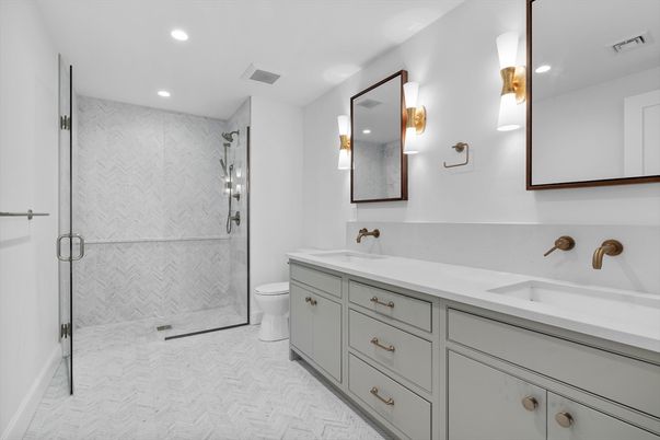 Bathroom, Dual Sink Vanities, Glass Shower, Interior, Marble, Marble Walls, Recessed Lighting