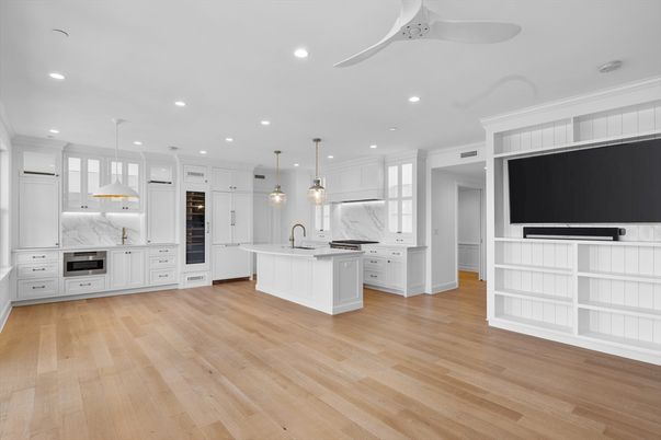 Interior, Kitchen, Marble Walls, Pendant Lights, Recessed Lighting, Stainless Steel Appliances, Wood Texture Flooring