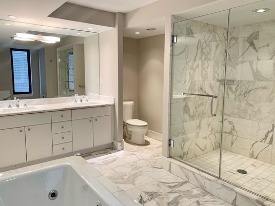 Bathroom, Dual Sink Vanities, Glass Shower, Interior, Marble, Marble Walls, Recessed Lighting