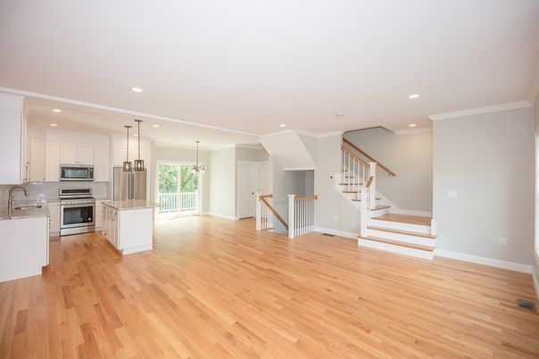 Empty room, Interior, Kitchen, Pendant Lights, Recessed Lighting, Stainless Steel Appliances, Wood Texture Flooring