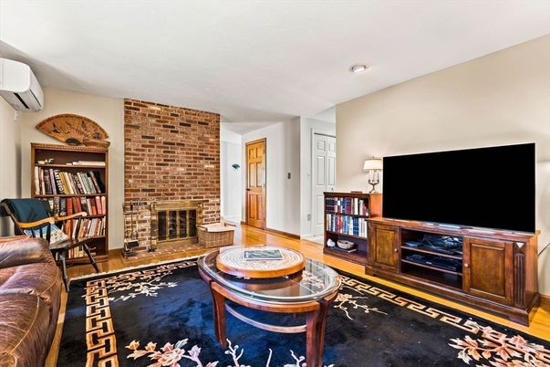 Fireplace, Interior, Living room, Recessed Lighting, Stone Walls, Wood Texture Flooring