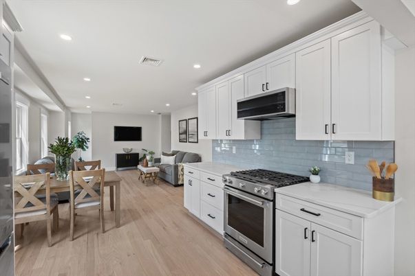 Dining room, Interior, Kitchen, Living room, Recessed Lighting, Stainless Steel Appliances, Wood Texture Flooring