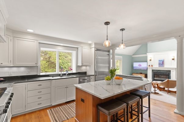 Fireplace, Interior, Kitchen, Living room, Pendant Lights, Recessed Lighting, Stainless Steel Appliances, Wood Texture Flooring