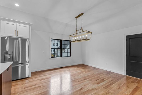 Empty room, Interior, Kitchen, Pendant Lights, Recessed Lighting, Stainless Steel Appliances, Wood Texture Flooring