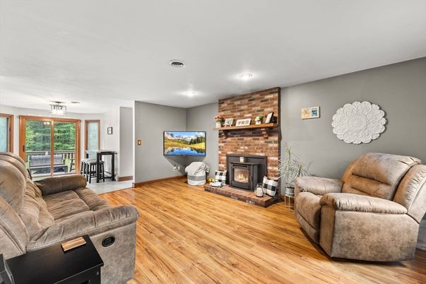 Fireplace, Interior, Living room, Recessed Lighting, Stone Walls, Wood Texture Flooring