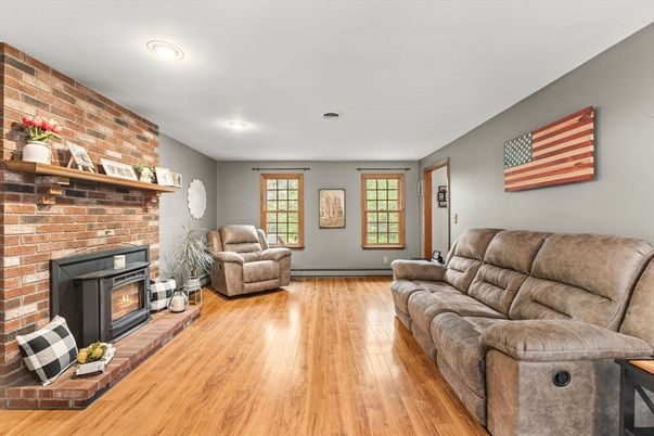 Fireplace, Interior, Living room, Recessed Lighting, Stone Walls, Wood Texture Flooring