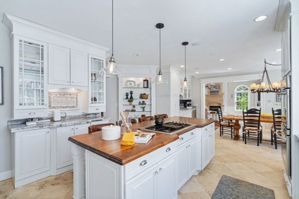 Chandelier, Dining room, Fireplace, Interior, Kitchen, Pendant Lights, Recessed Lighting, Stainless Steel Appliances