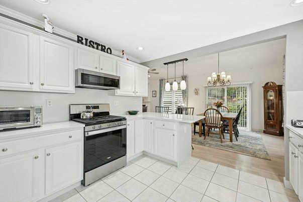 Chandelier, Dining room, Interior, Kitchen, Pendant Lights, Recessed Lighting, Stainless Steel Appliances, Wood Texture Flooring