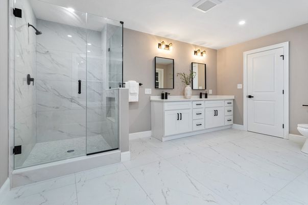 Bathroom, Dual Sink Vanities, Glass Shower, Interior, Marble, Marble Walls, Recessed Lighting