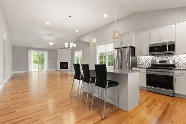 Chandelier, Fireplace, Interior, Kitchen, Pendant Lights, Recessed Lighting, Stainless Steel Appliances, Wood Texture Flooring