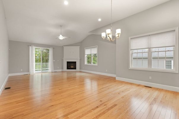 Chandelier, Empty room, Fireplace, Interior, Pendant Lights, Recessed Lighting, Wood Texture Flooring