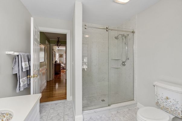 Bathroom, Glass Shower, Interior, Marble, Marble Walls, Recessed Lighting, Wood Texture Flooring