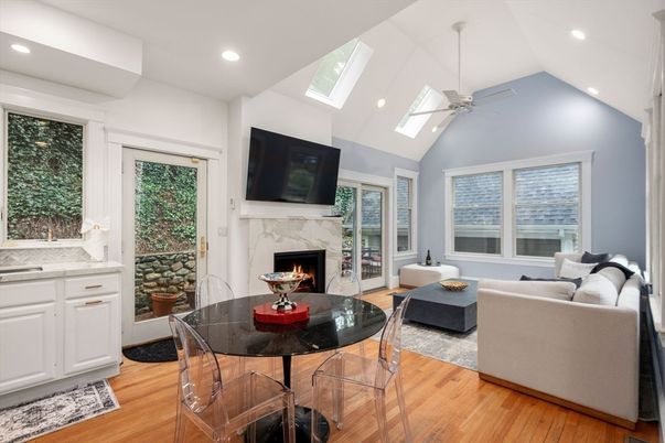 Dining room, Fireplace, Interior, Living room, Recessed Lighting, Wood Texture Flooring