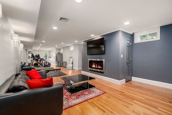 Fireplace, Fitness Equipment, Interior, Living room, Recessed Lighting, Wood Texture Flooring