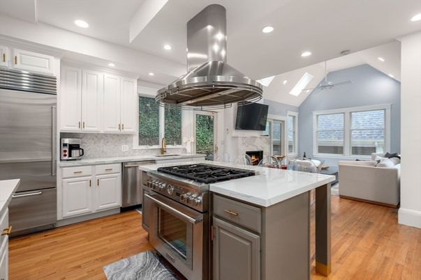 Fireplace, Interior, Kitchen, Living room, Recessed Lighting, Stainless Steel Appliances, Wood Texture Flooring