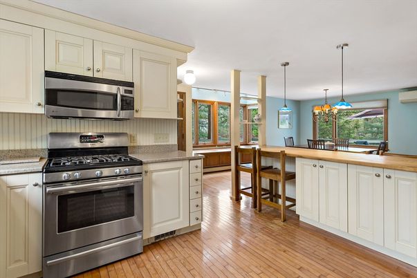 Dining room, Interior, Kitchen, Pendant Lights, Stainless Steel Appliances, Wood Texture Flooring