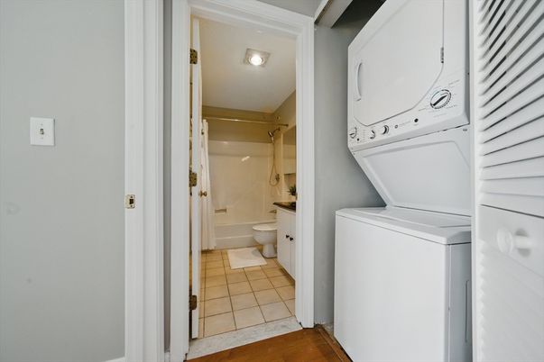 Bathroom, Glass Shower, Interior, Utility Closets, Washer, Wood Texture Flooring