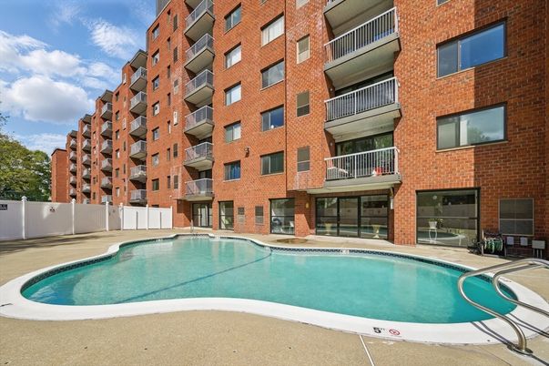 Exterior, Facade, Brick Facade, Pool, Condo Building