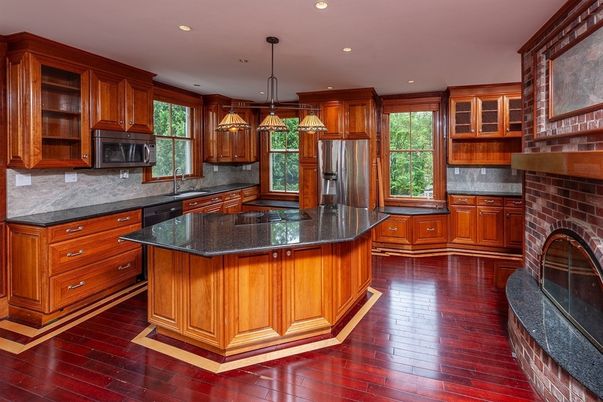 Fireplace, Interior, Kitchen, Pendant Lights, Recessed Lighting, Stainless Steel Appliances, Stone Walls, Wood Texture Flooring