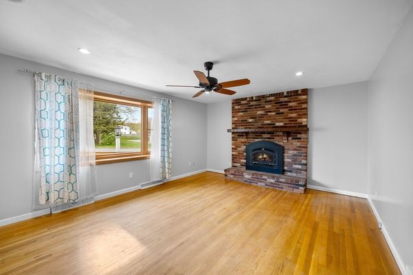 Empty room, Fireplace, Interior, Recessed Lighting, Stone Walls, Wood Texture Flooring