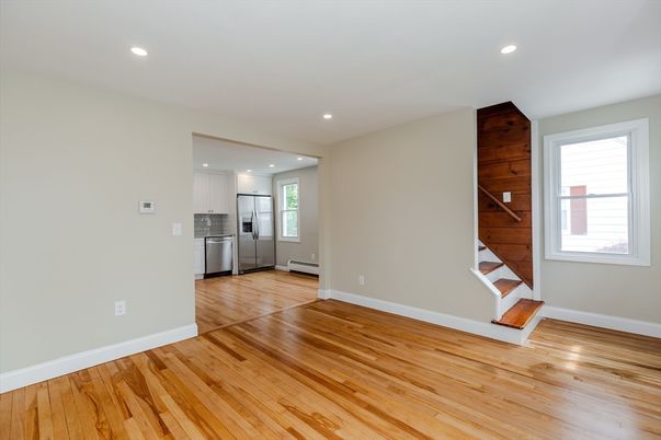 Empty room, Interior, Kitchen, Recessed Lighting, Stainless Steel Appliances, Wood Texture Flooring