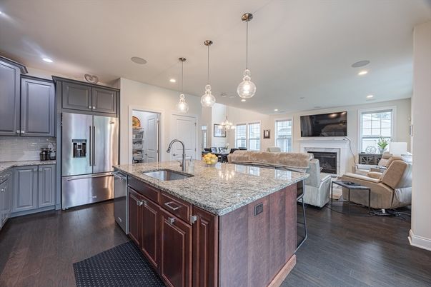 Fireplace, Interior, Kitchen, Living room, Pendant Lights, Recessed Lighting, Stainless Steel Appliances, Wood Texture Flooring
