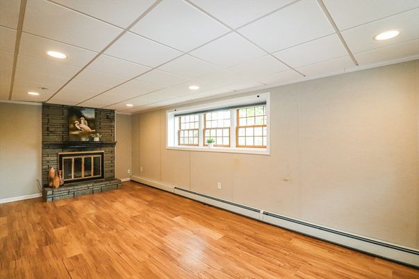 Empty room, Fireplace, Interior, Recessed Lighting, Stone Walls, Wood Texture Flooring