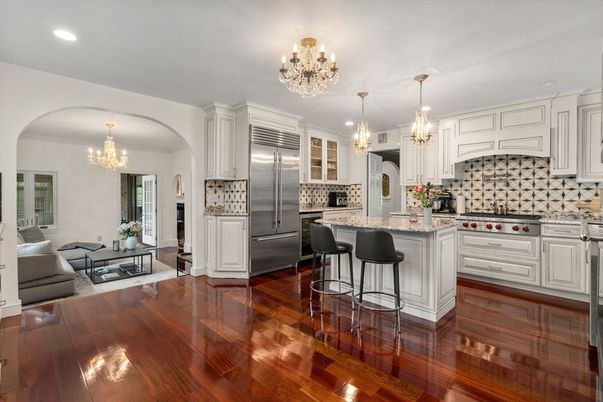 Chandelier, Interior, Kitchen, Living room, Pendant Lights, Recessed Lighting, Stainless Steel Appliances, Wood Texture Flooring