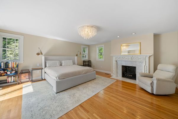 Bedroom, Chandelier, Fireplace, Interior, Recessed Lighting, Wood Texture Flooring