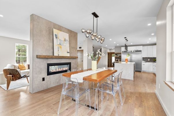 Dining room, Fireplace, Interior, Kitchen, Pendant Lights, Recessed Lighting, Stainless Steel Appliances, Wood Texture Flooring
