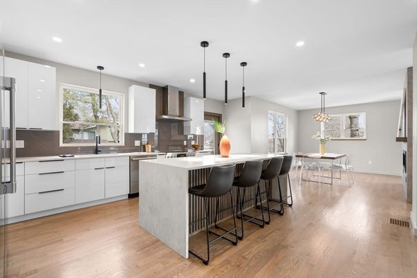 Dining room, Interior, Kitchen, Pendant Lights, Recessed Lighting, Stainless Steel Appliances, Wood Texture Flooring
