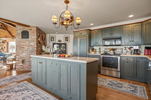 Chandelier, Interior, Kitchen, Recessed Lighting, Stainless Steel Appliances, Stone Walls, Wood Texture Flooring
