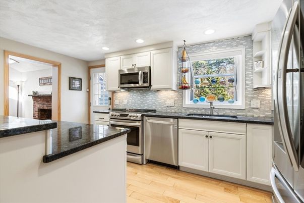 Fireplace, Interior, Kitchen, Recessed Lighting, Stainless Steel Appliances, Wood Texture Flooring