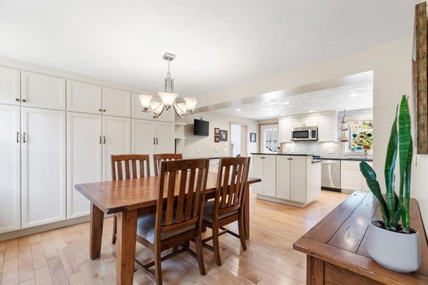 Chandelier, Dining room, Interior, Kitchen, Recessed Lighting, Stainless Steel Appliances, Wood Texture Flooring