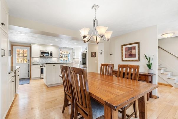 Chandelier, Dining room, Interior, Kitchen, Recessed Lighting, Stainless Steel Appliances, Wood Texture Flooring