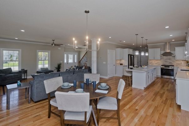 Chandelier, Dining room, Interior, Kitchen, Living room, Pendant Lights, Recessed Lighting, Stainless Steel Appliances, Wood Texture Flooring