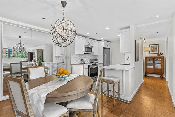 Chandelier, Dining room, Interior, Kitchen, Pendant Lights, Recessed Lighting, Stainless Steel Appliances, Wood Texture Flooring