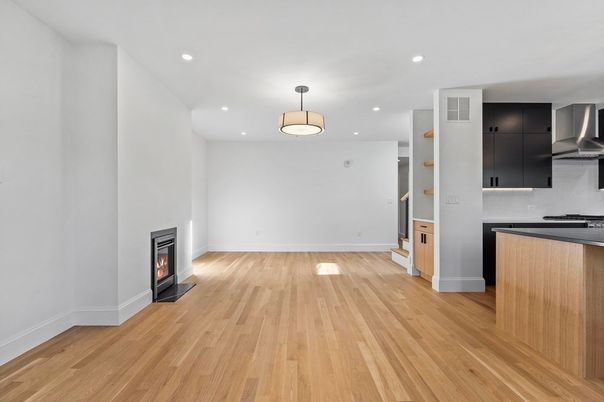 Empty room, Fireplace, Interior, Kitchen, Pendant Lights, Recessed Lighting, Wood Texture Flooring