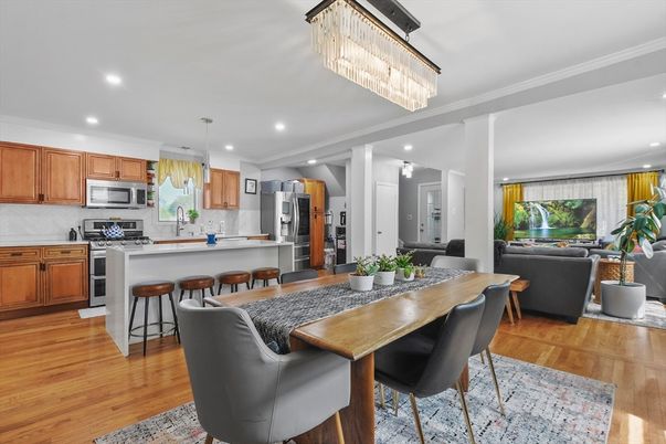Chandelier, Dining room, Interior, Kitchen, Living room, Pendant Lights, Recessed Lighting, Stainless Steel Appliances, Wood Texture Flooring