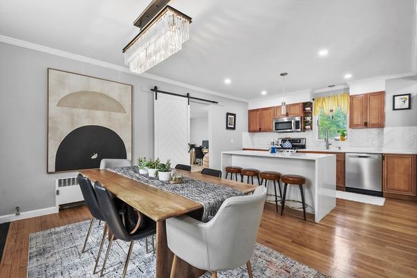 Chandelier, Dining room, Interior, Kitchen, Pendant Lights, Recessed Lighting, Stainless Steel Appliances, Wood Texture Flooring