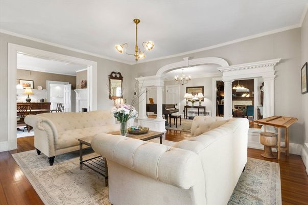 Chandelier, Dining room, Fireplace, Interior, Living room, Pendant Lights, Piano, Wood Texture Flooring